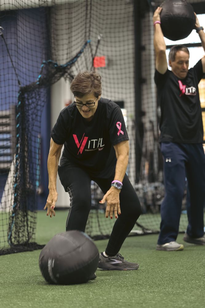 VITAL member training with battle ropes during a coached small group session in Orange, Connecticut